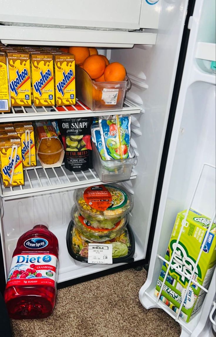 an open refrigerator filled with lots of food