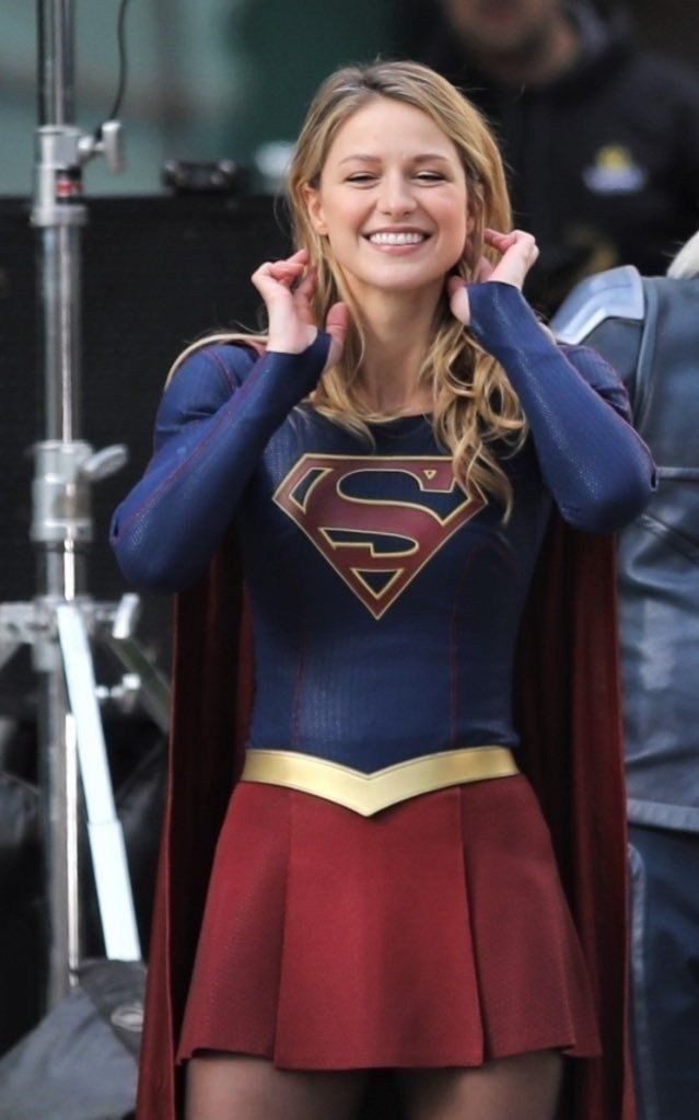 a woman in a superman costume on the set of her new movie, supergirl