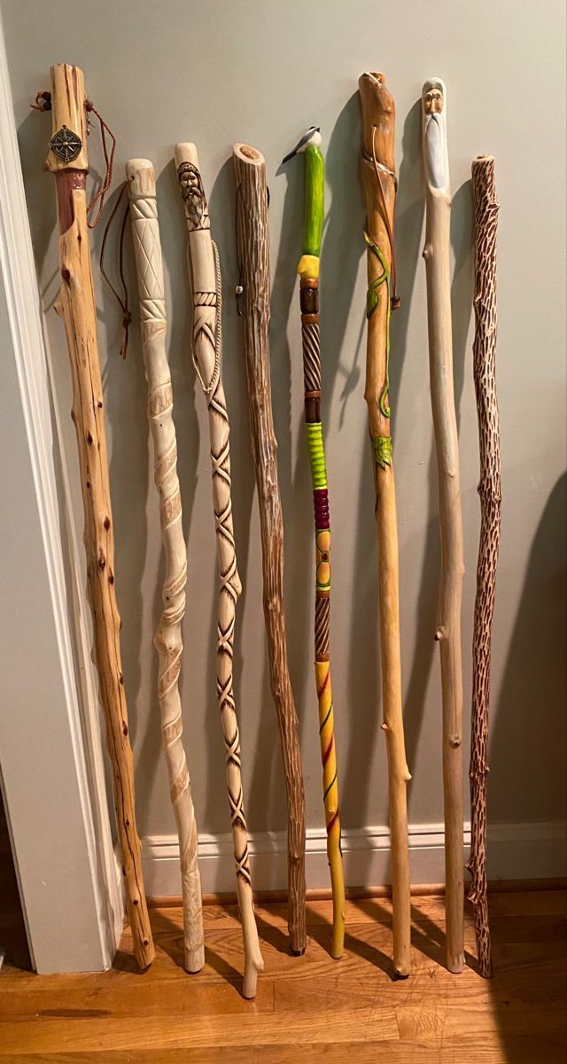 there are many different types of sticks lined up on the wall next to each other