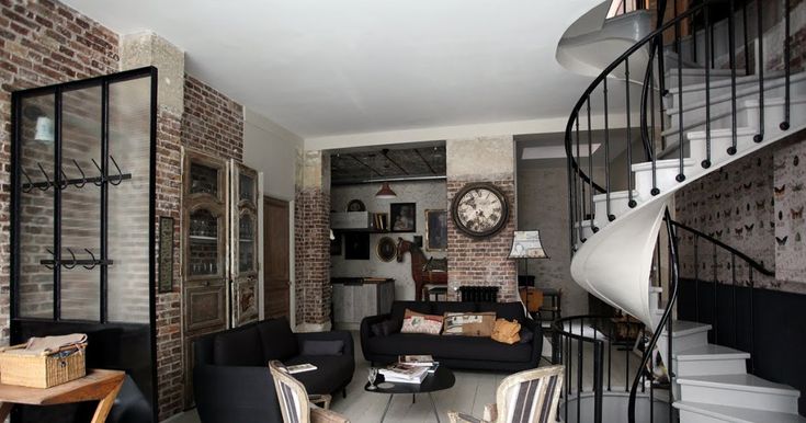 an office with black walls and white furniture