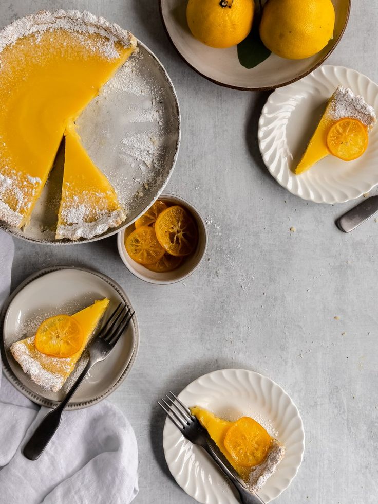 three plates with slices of lemon pie on them