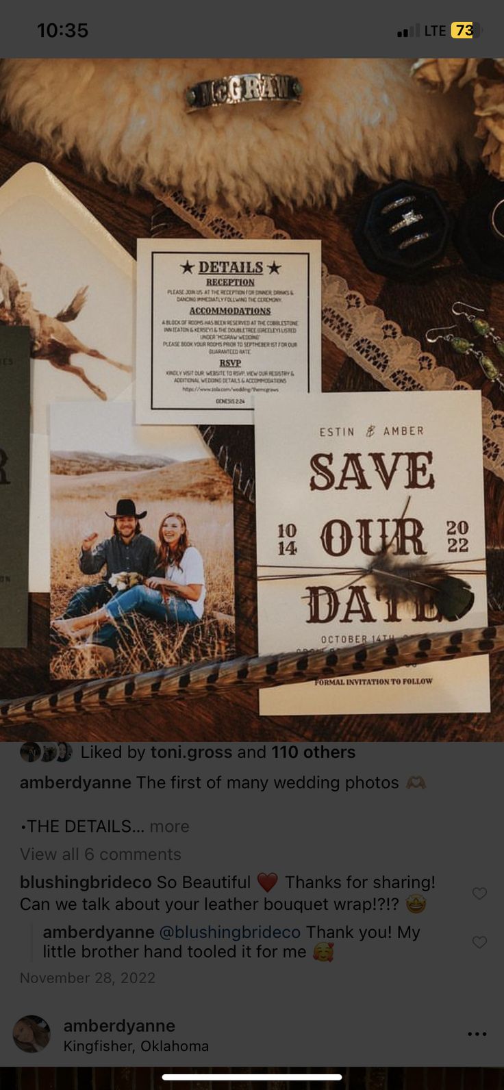 the wedding stationery is laid out on top of an old suitcase with other items