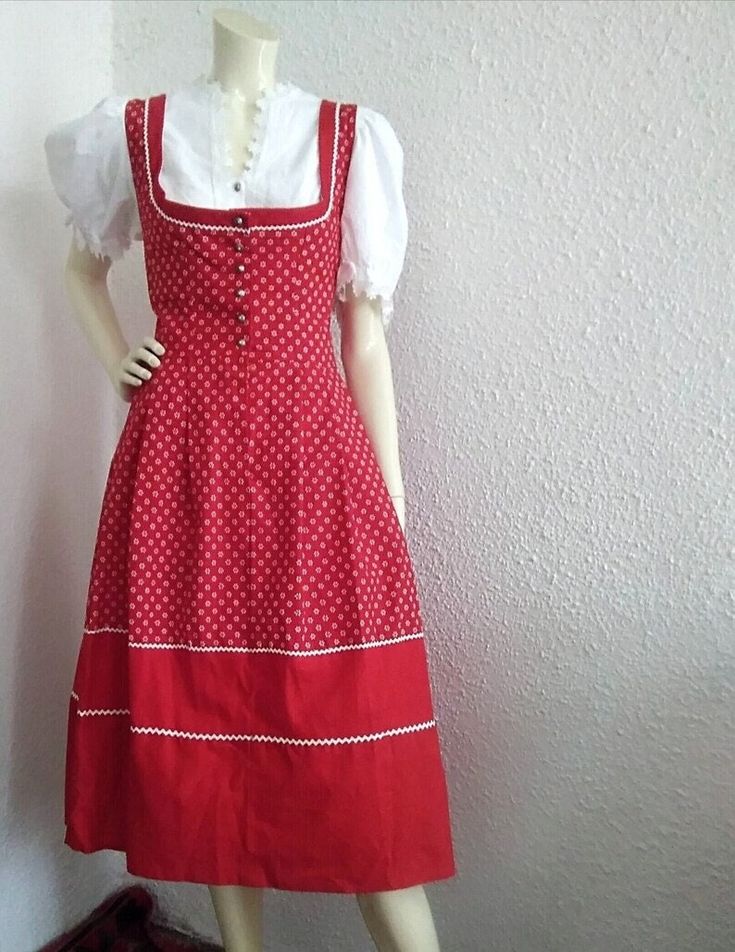 70s folk dress red millefleur trachten dress, bavarian austrian dress, tyrolean peasant dress, probably cotton fabric, cottagecore red floral dress. The color is vivid red. The fabric look like cotton, but I cannot be sure 100% about that. Is in very good vintage condition, probably was not used, but have inside on the back a small stain, probably because of the glue of his label sizewich is removed and remain his stain (please see the photo). This stain is inside of the dress, not visible outside. measurements lying flat : shoulders :42 cm (16.5 inches) bust:44cm (17,5 inches) waist :35 cm (13,5 inches) total length :114 cm (45 inches) Bavarian Dress, Folk Dress, Dress Cottagecore, Folk Dresses, Red Floral Dress, Peasant Dress, Dress Red, Dress Clothes For Women, Red Floral