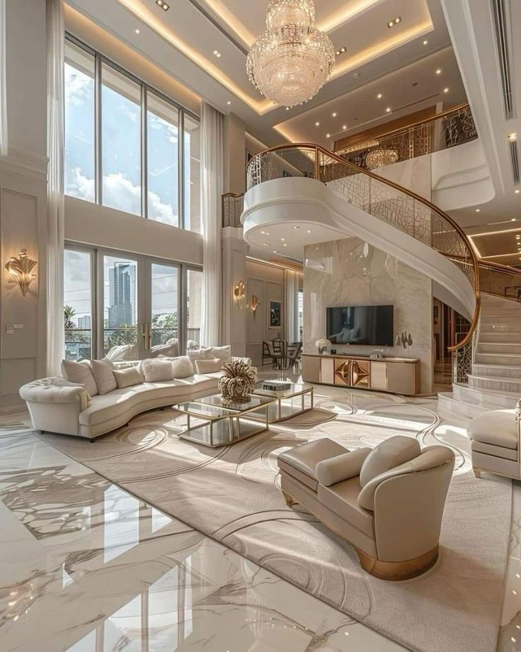 a living room filled with lots of furniture and a spiral staircase leading up to the second floor