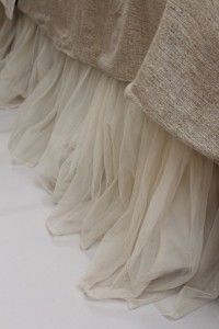 there are many layers of fabric on the bed skirt, which is very long and thin