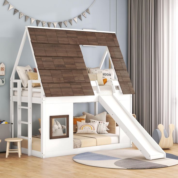 a child's bedroom with a white bunk bed and a slide in the corner