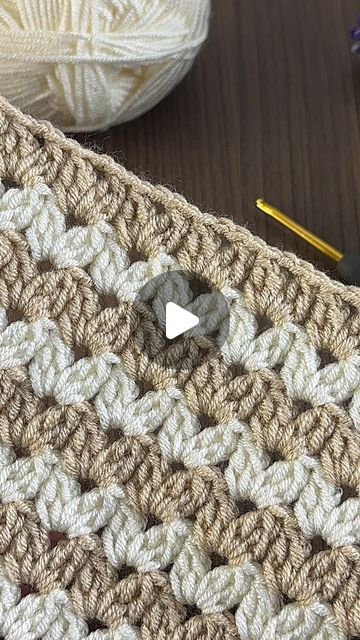 a crochet pattern with a ball of yarn next to it