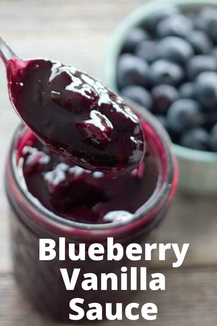 a spoon full of blueberry sauce with the words vanilla blueberry sauce above it