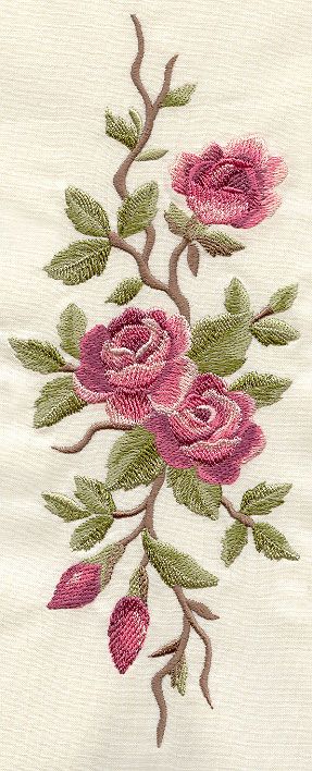 an embroidered piece of cloth with pink roses on it