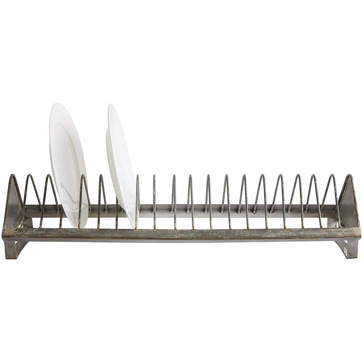 a metal dish rack with three plates on it