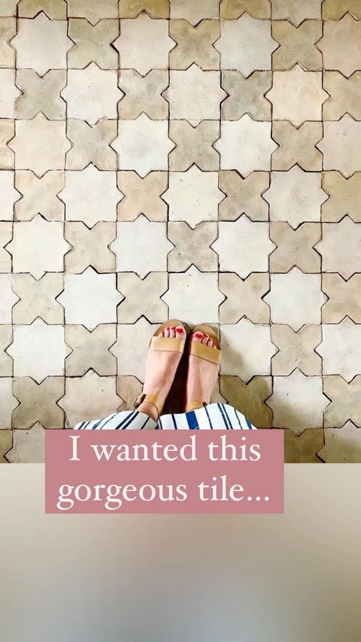 someone is laying down with their feet up on the ground and texting i wanted this gorgeous tile