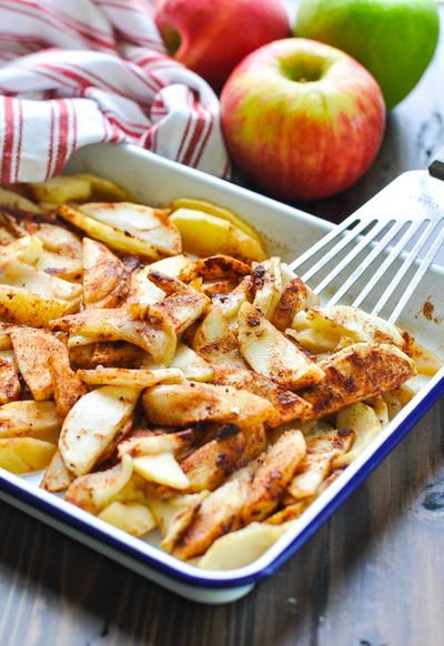 an apple pie in a pan with a fork