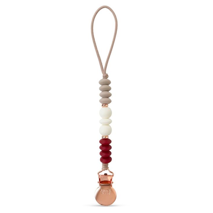 a pacifier is hanging from a cord with beads on the end and an orange bead