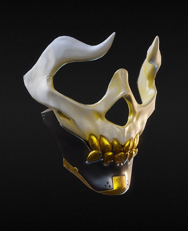 a white mask with gold accents on it