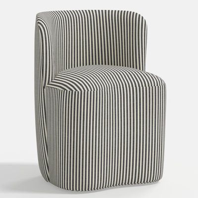 a black and white striped chair sitting on top of a floor