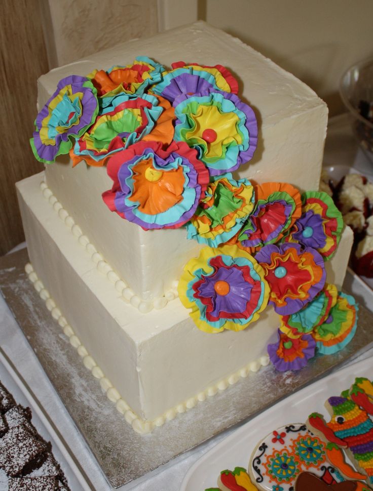 there is a cake decorated with colorful decorations