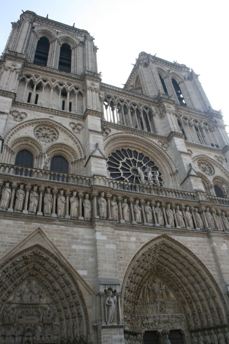 the large cathedral has many statues on it