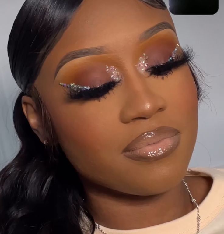 Natural Beat Makeup With Rhinestones, Makeup Look With Rhinestones Black Women, Birthday Makeup With Rhinestones, Jewel Makeup Looks, Silver Rhinestone Makeup Black Women, Rine Stone Makeup Black Women, Makeup Looks With Gems, Rhinestone Wing Liner, Rhinestones Makeup