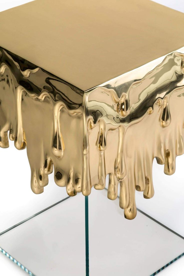 an artistic table with gold paint on it