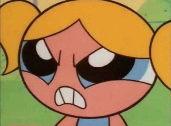 the face of a cartoon character with big eyes and an angry look on her face