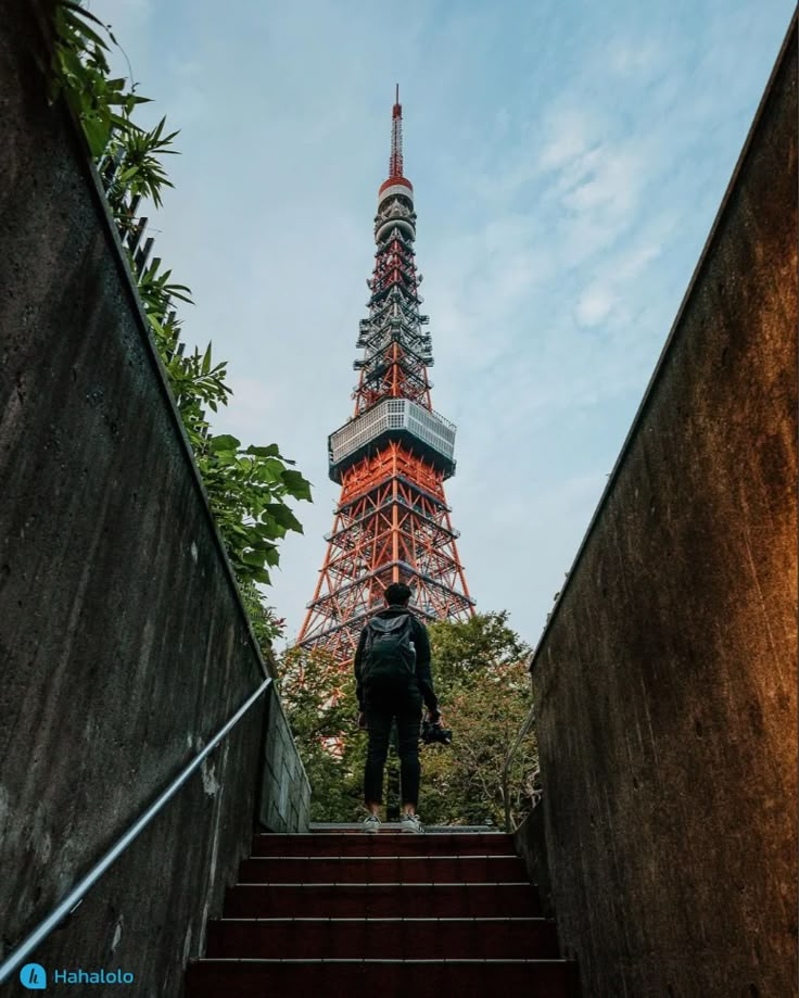 the eiffel tower in paris is lit up with red and white lights on it