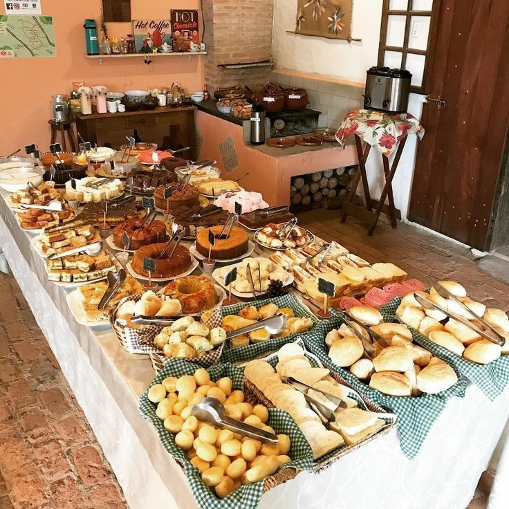 a table filled with lots of different types of pastries and desserts on it