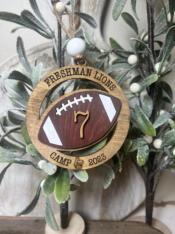 a wooden ornament with a football on it