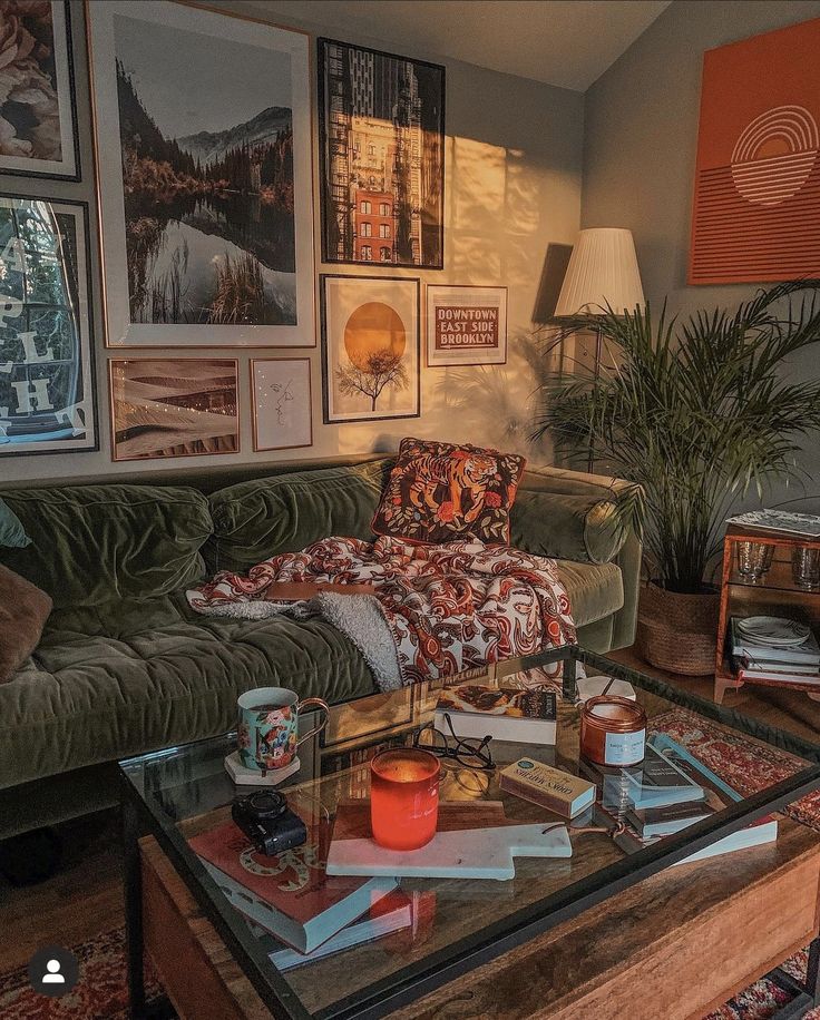 a living room filled with furniture and lots of pictures on the wall above it's coffee table