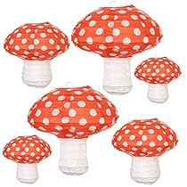 six red and white polka doted mushrooms with clear caps on each mushroom, set against a white background