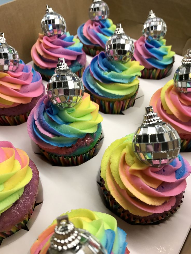 cupcakes with colorful frosting and disco ball decorations