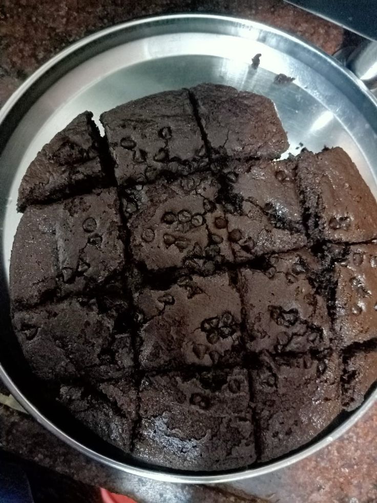 a metal pan filled with brownies on top of a counter