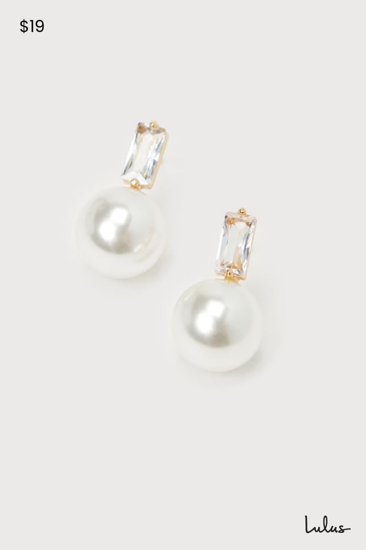 When you need to complete any special occasion look, the Lulus Elegant Passion White Pearl 14KT Gold Rhinestone Stud Earrings are the most stunning way to do so! These sophisticated earrings start with baguette-shaped rhinestone posts (with 14KT gold-plated settings) that support a gleaming, oversized faux pearl charm that completes the poised look. Make sure to wear an updo so you can show off these perfect beauties! This item is plated with real 14KT gold. Love it and it will love you back! Remove before exercising or showering, and when applying scents, lotions and sprays. Post backs. 0. 75" Long. 14K Gold Dipped Brass 25%, Glass 15%, Plastic 60%. Imported. Lulus | Elegant Passion White Pearl 14KT Gold Rhinestone Stud Earrings. Pearl And Diamond Drop Earrings, Wedding Jewelry Strapless Dress, Pearl Bride Earrings, Bride Earrings Pearl, Sophisticated Earrings, Pearl Drop Earrings Bridal, Bridal Jewellery Earrings, Pearl Bride, Formal Earrings