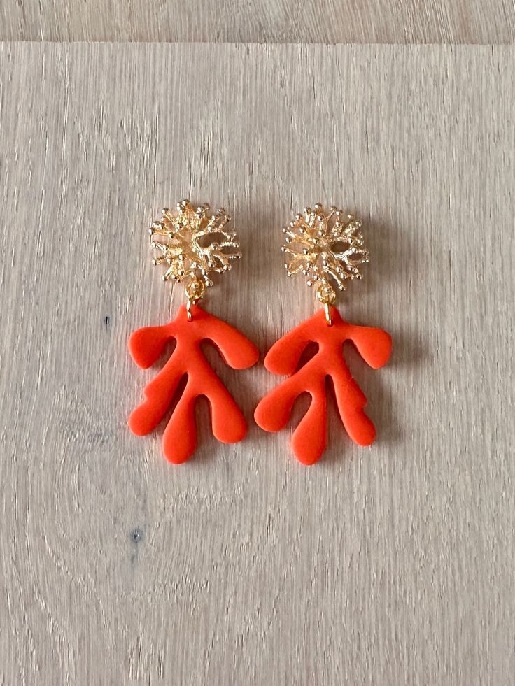 Saturated colour, super bright coral orange paired with 18k gold-plated coral stud makes the perfect chic statement earrings! 18k Gold Hardware & Polymer Clay Your earrings will arrive in a handmade jewellery bag, gift-wrapped and with 100% plastic-free packaging, ready to gift. Handmade in Margaret River, Western Australia. All earrings are made from polymer clay which gives a lightweight result. My process includes mixing my own colours, baking, sanding, buffing, and assembling.  - CARE INSTRUCTIONS - Store in a clean, dry place. Do not swim, sleep or exercise in your handmade accessories or earrings. They may break if twisted, bent or dropped.  Do not let your accessories come into contact with aerosol sprays, creams/lotions. It will affect and erode the finish and affect longevity of y Bold Orange Party Jewelry, Handmade Coral Earrings For Party, Coral Clay Earrings, Summer Beach Coral Earrings, Bold Orange Drop Earrings, Coral Earring, Gold Coral Earrings, Coral Gold Earing, Cute Christmas Stockings