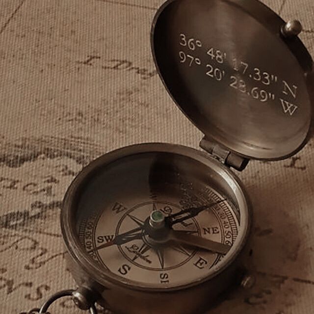 an old compass is sitting on the floor