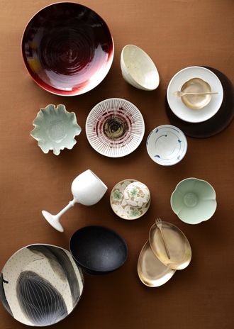 various bowls and plates are arranged on a table