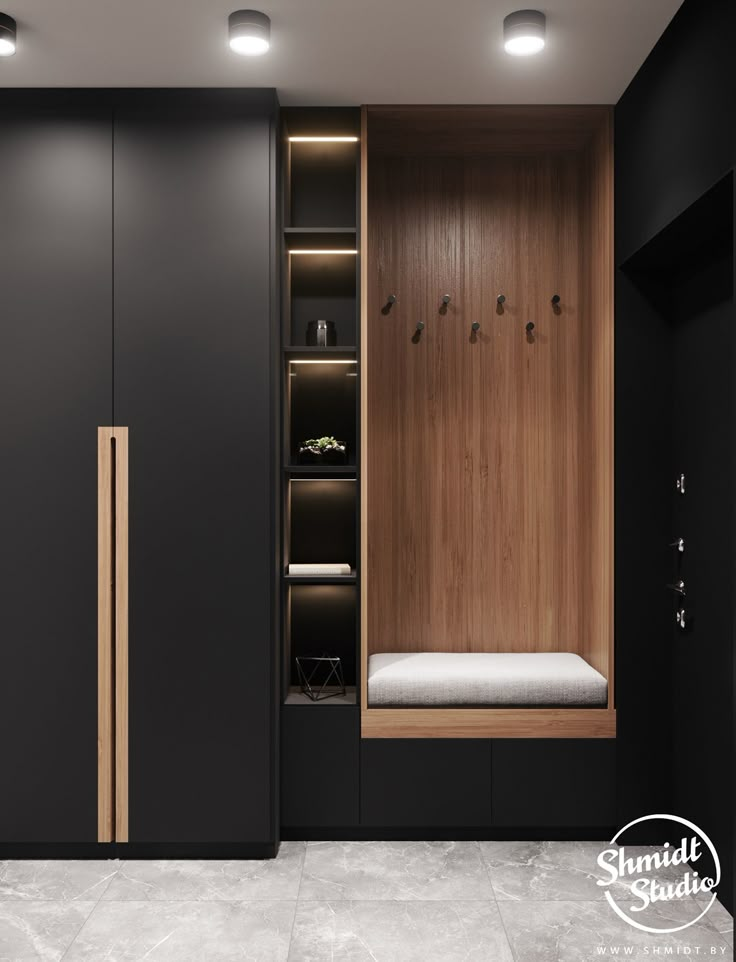 a walk in closet with black walls and white flooring, built into the wall