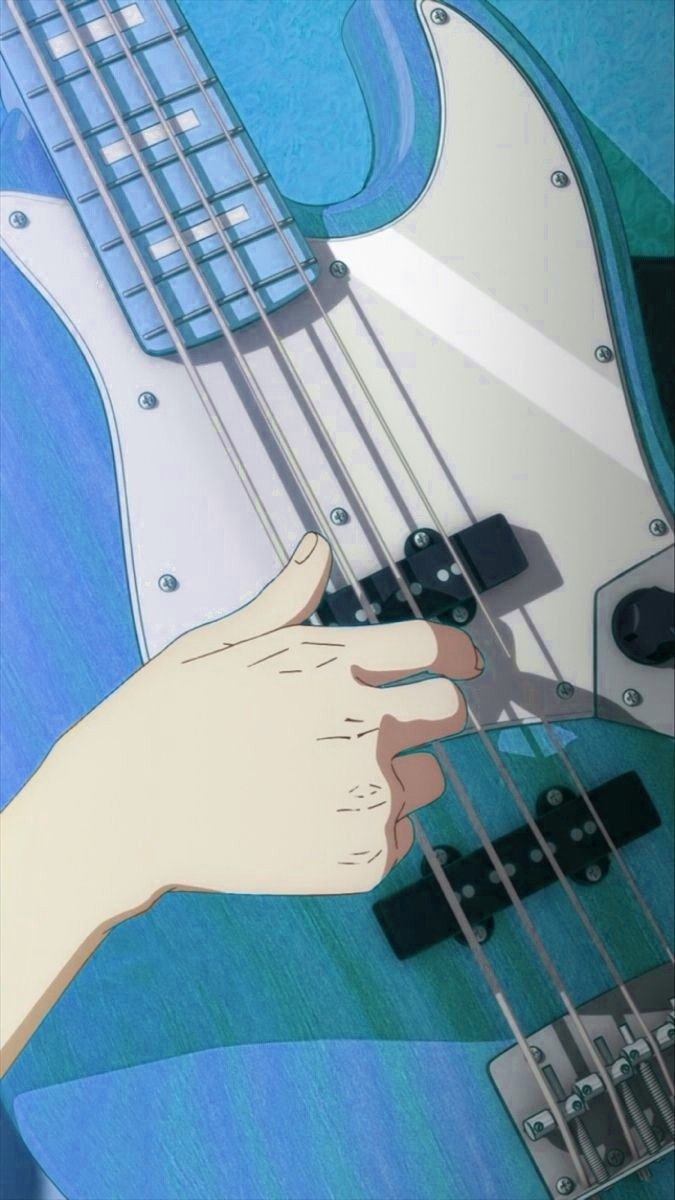 a person holding an electric guitar in their left hand and touching it with the other hand