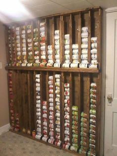 a kitchen storage unit filled with lots of canned food in it's pallets