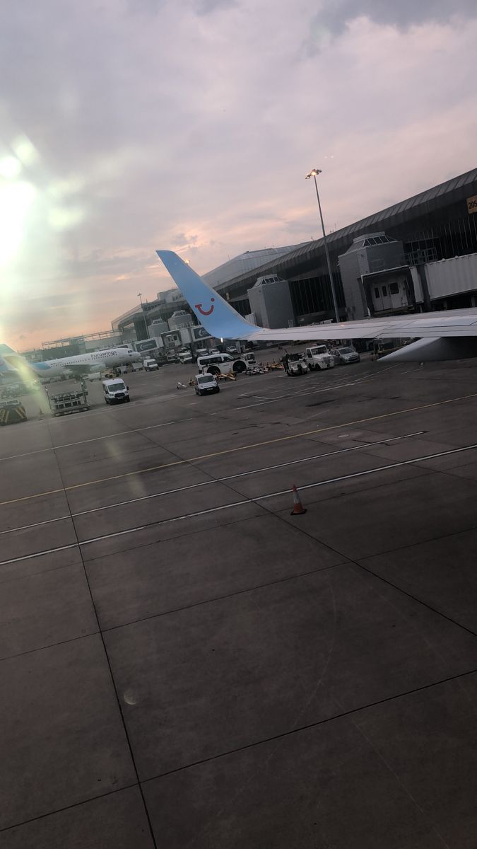 an airplane parked on the tarmac at an airport