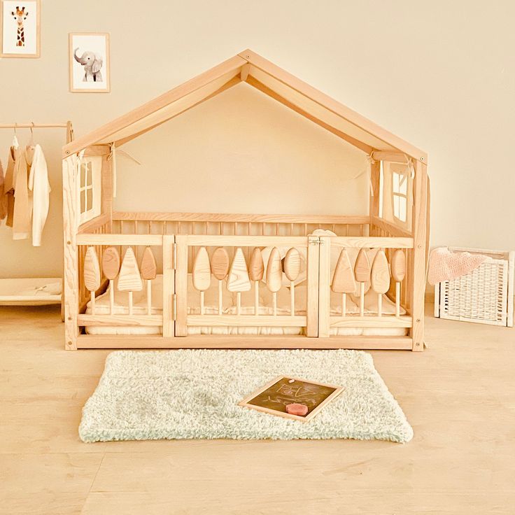 a baby's crib in the middle of a room next to a rug