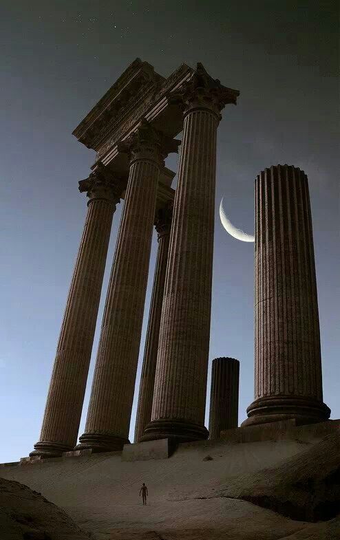 the moon is setting behind some ancient columns