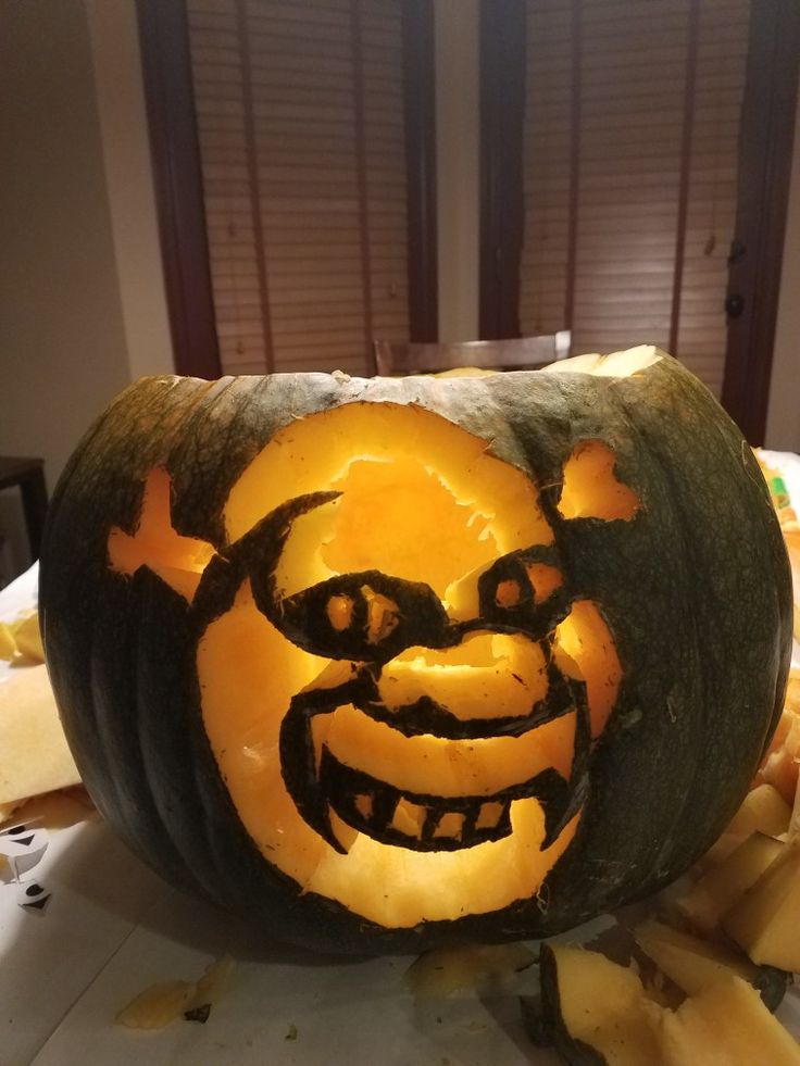 a carved pumpkin with an evil face on it