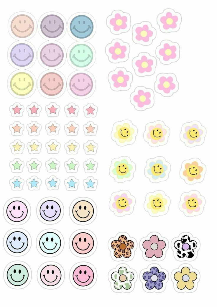 several different types of smiley face stickers on a white background, each with different colors and shapes