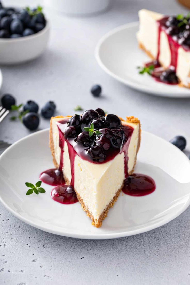 a blueberry cheesecake on a plate with a fork