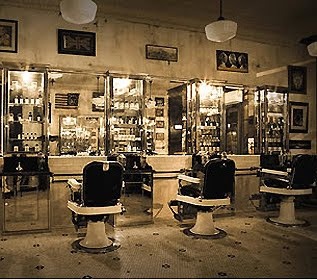 an old fashioned barber shop with chairs and mirrors