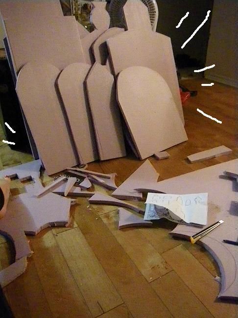 several pieces of cardboard sitting on top of a wooden floor