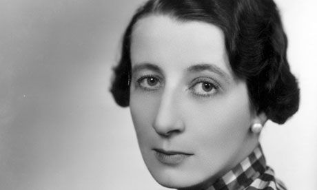 an old black and white photo of a woman wearing a checkered neck tie with her eyes wide open