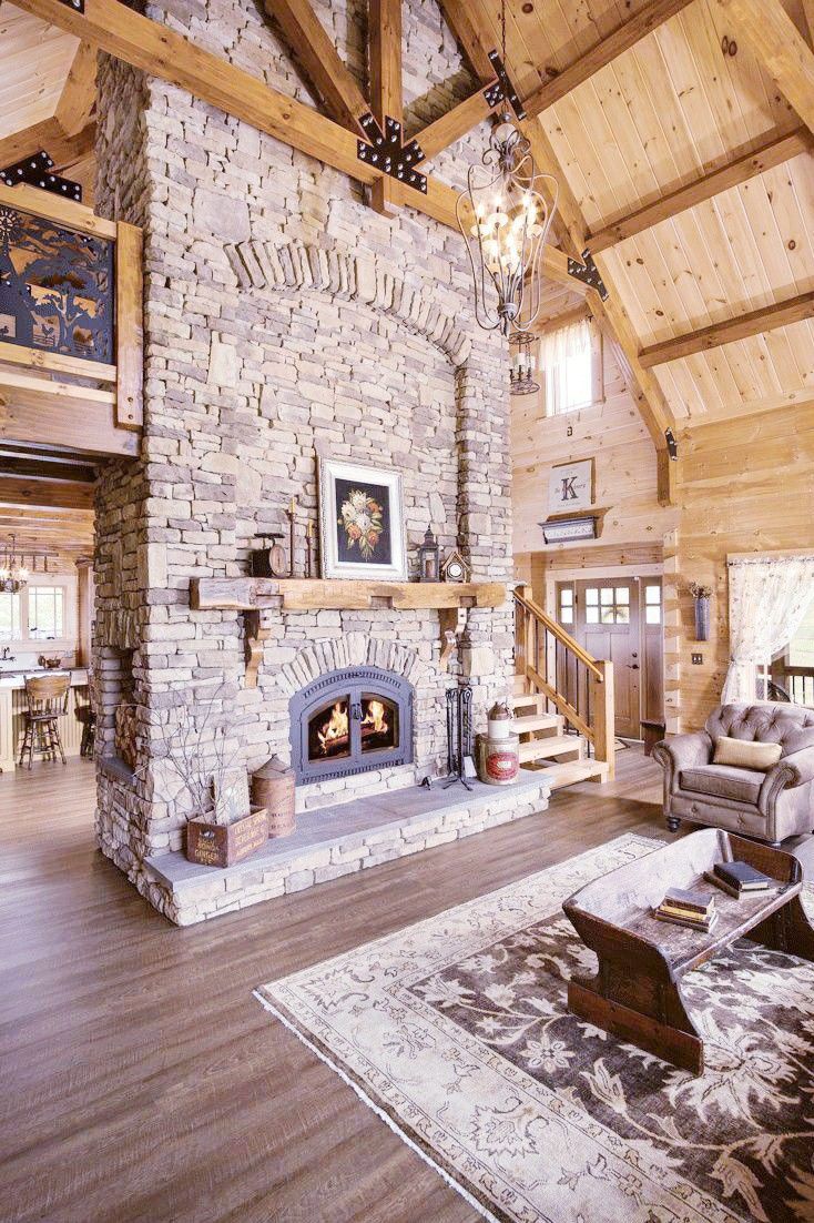 a living room filled with furniture and a fire place in the middle of a room