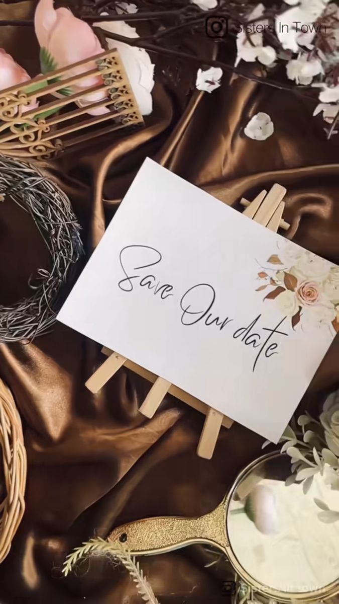 there is a sign that says save our date next to some flowers and other decorations