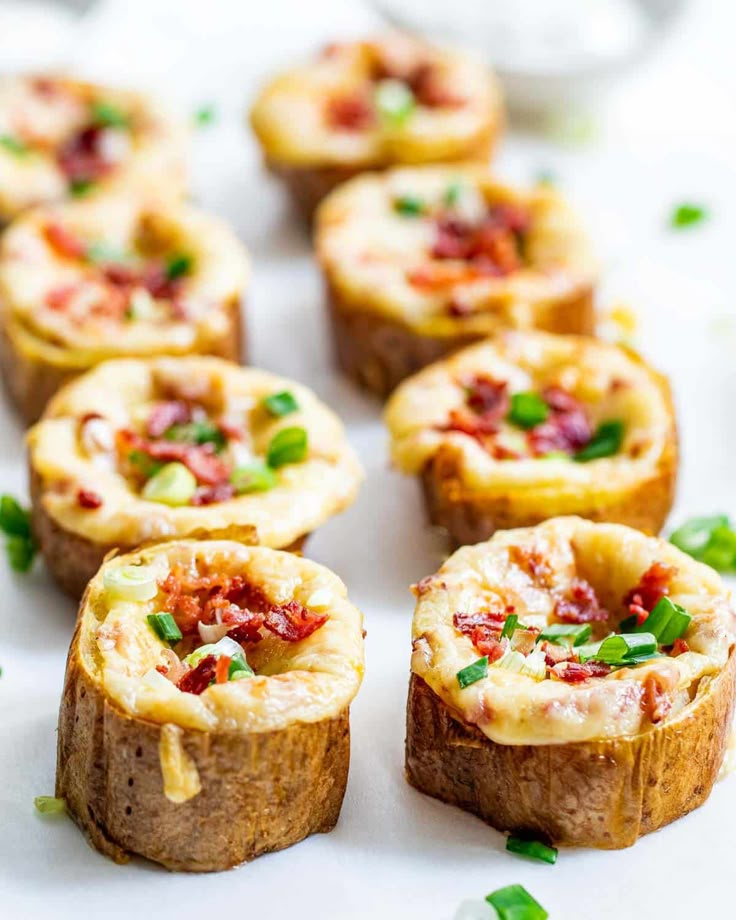 small appetizers are arranged on a white platter